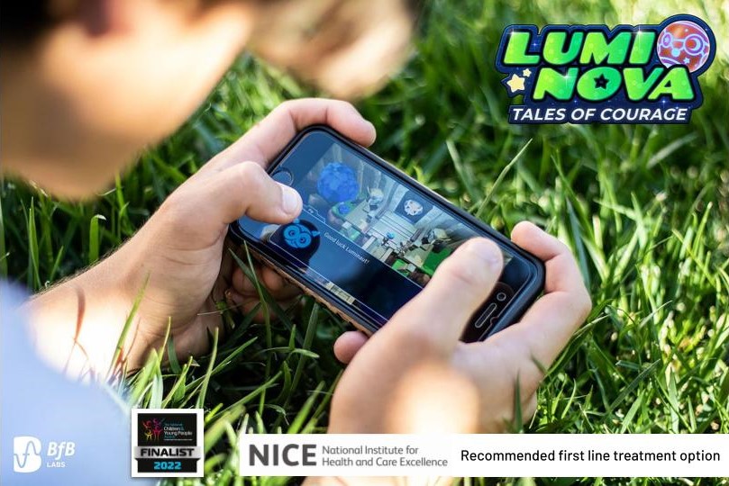 the photo shows a young person holding their mobile phone sideways and using the Lumi Nova app